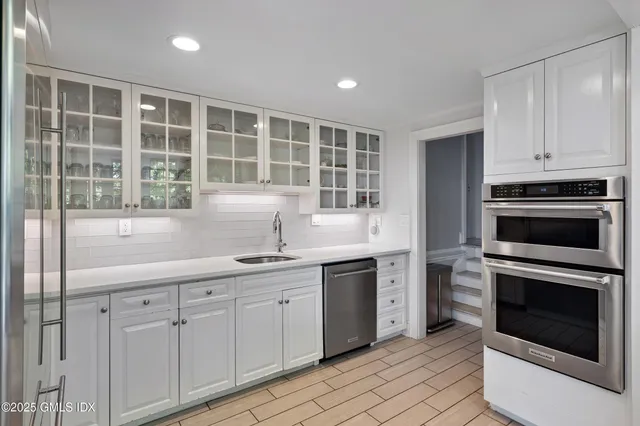 a kitchen with a sink stove and microwave