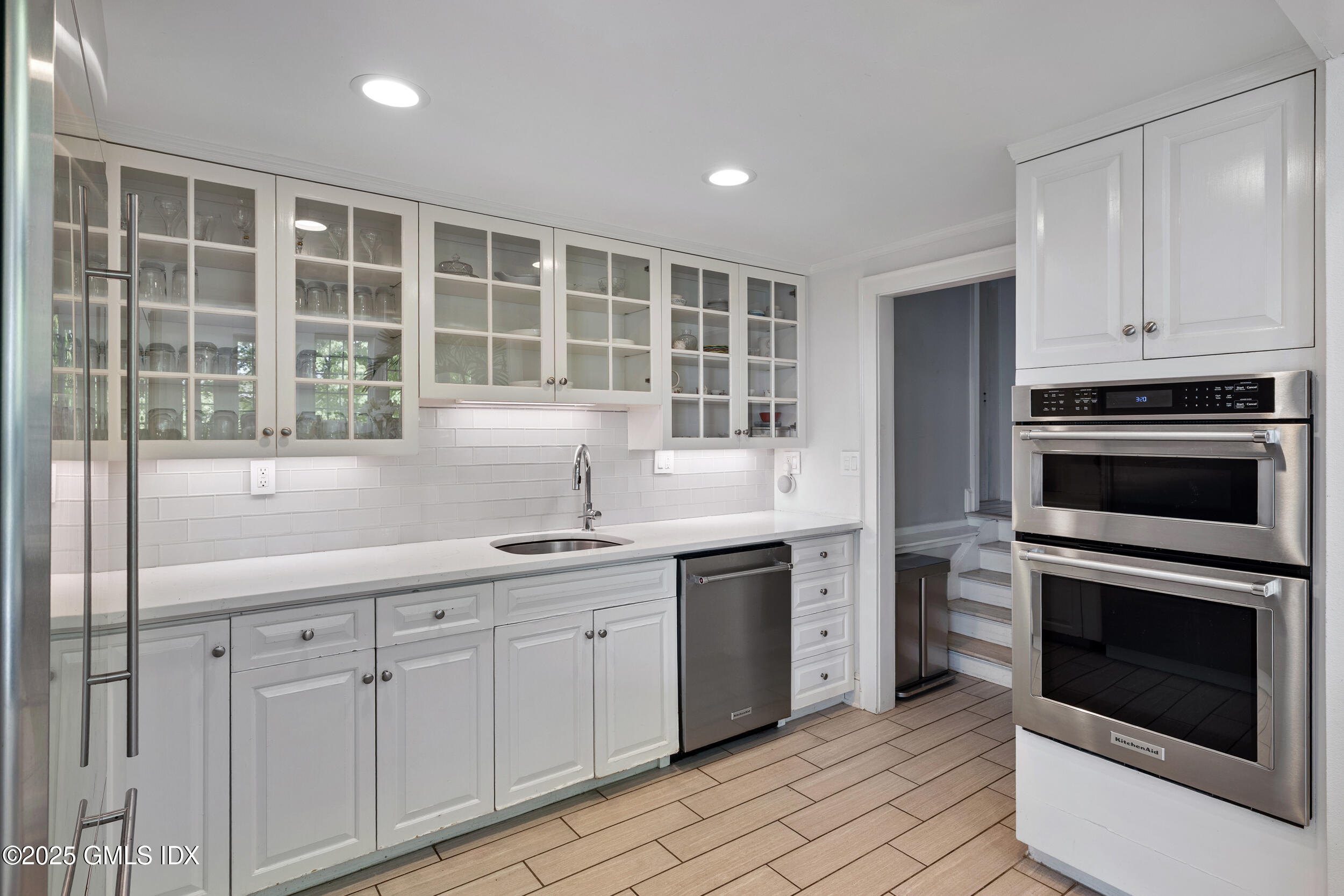 467 Laurel Road New Canaan, CT 06840 - Photo 18 of 50 a kitchen with a sink stove and microwave