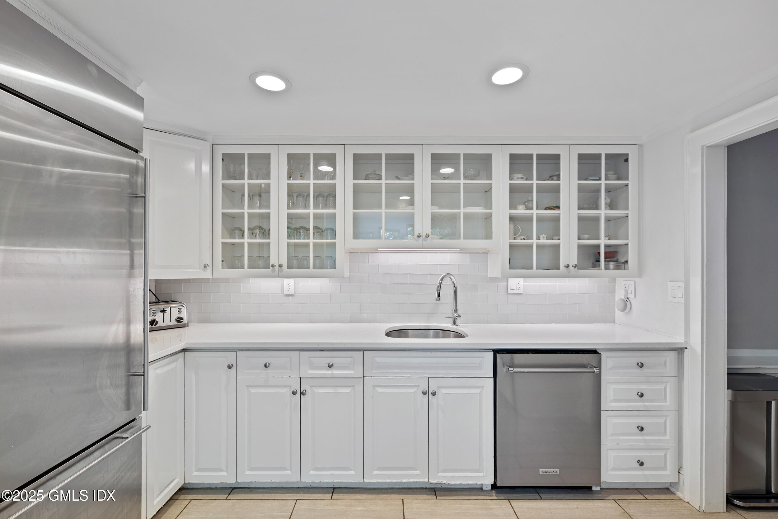 467 Laurel Road New Canaan, CT 06840 - Photo 19 of 50 a kitchen with a sink and cabinets