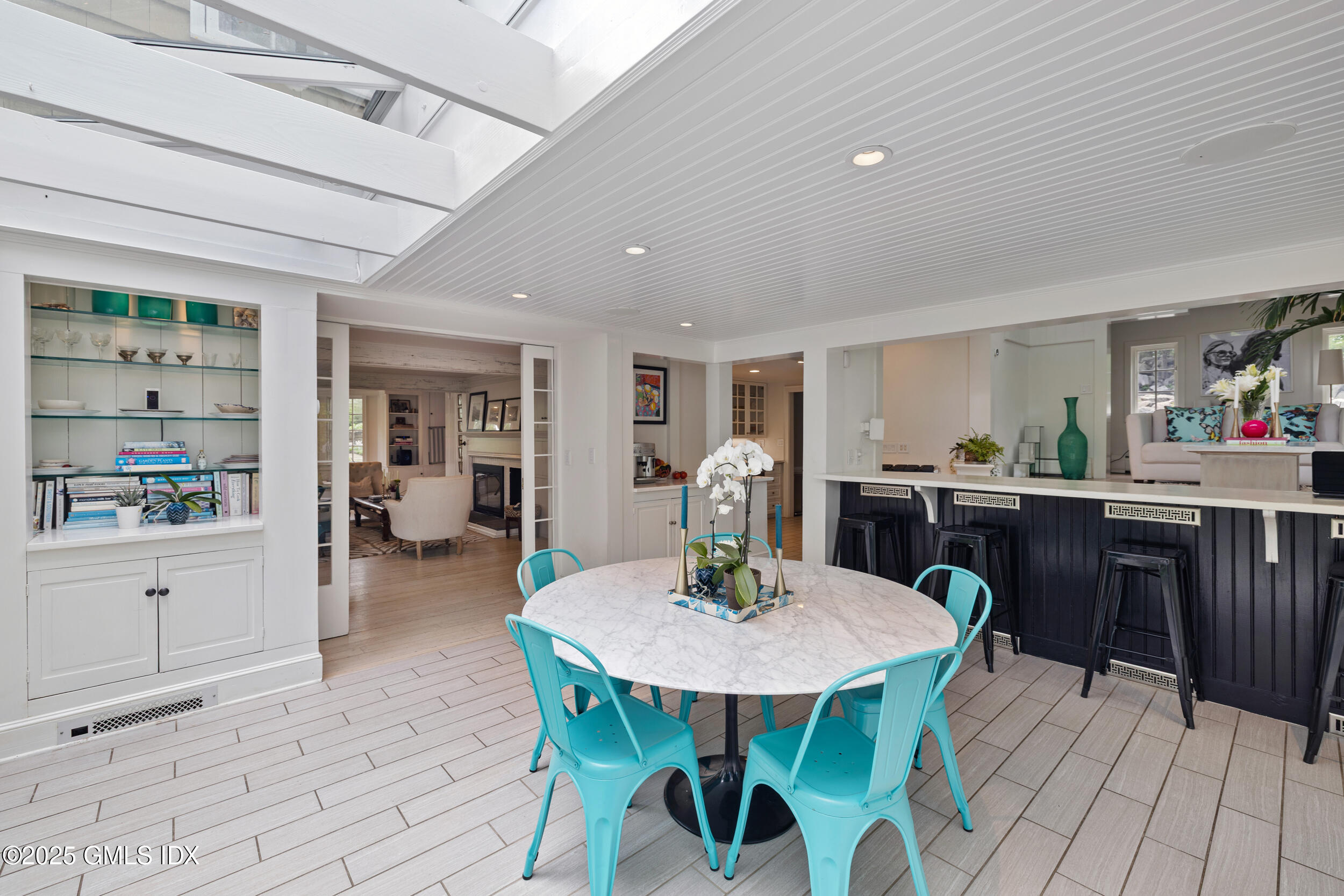 467 Laurel Road New Canaan, CT 06840 - Photo 22 of 50 a view of a dining room with furniture