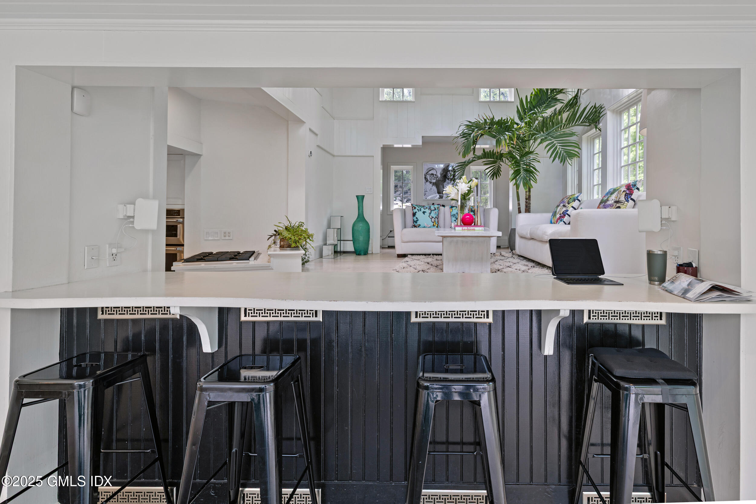 467 Laurel Road New Canaan, CT 06840 - Photo 23 of 50 a kitchen with a table and chairs in it