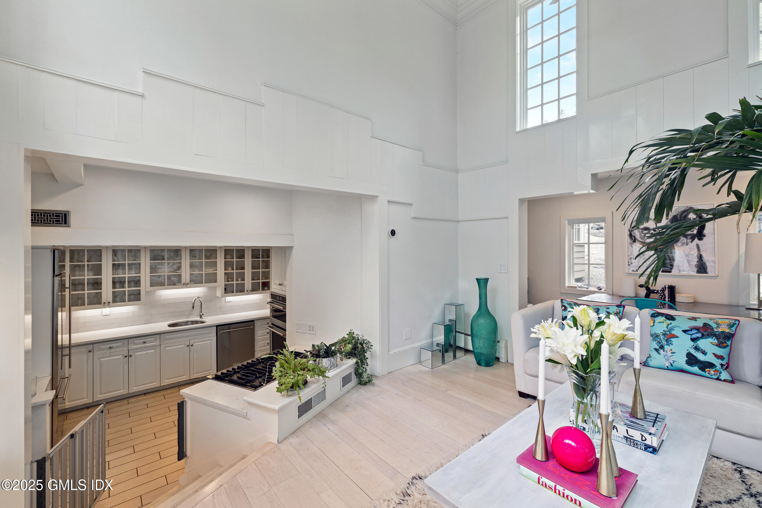 467 Laurel Road New Canaan, CT 06840 - Photo 25 of 50 a living room with furniture flowerpot and flower pot