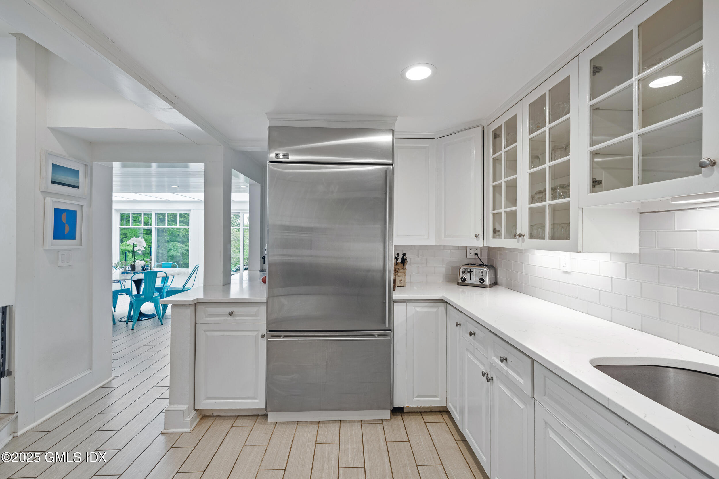 467 Laurel Road New Canaan, CT 06840 - Photo 27 of 50 a kitchen with a sink appliances and cabinets