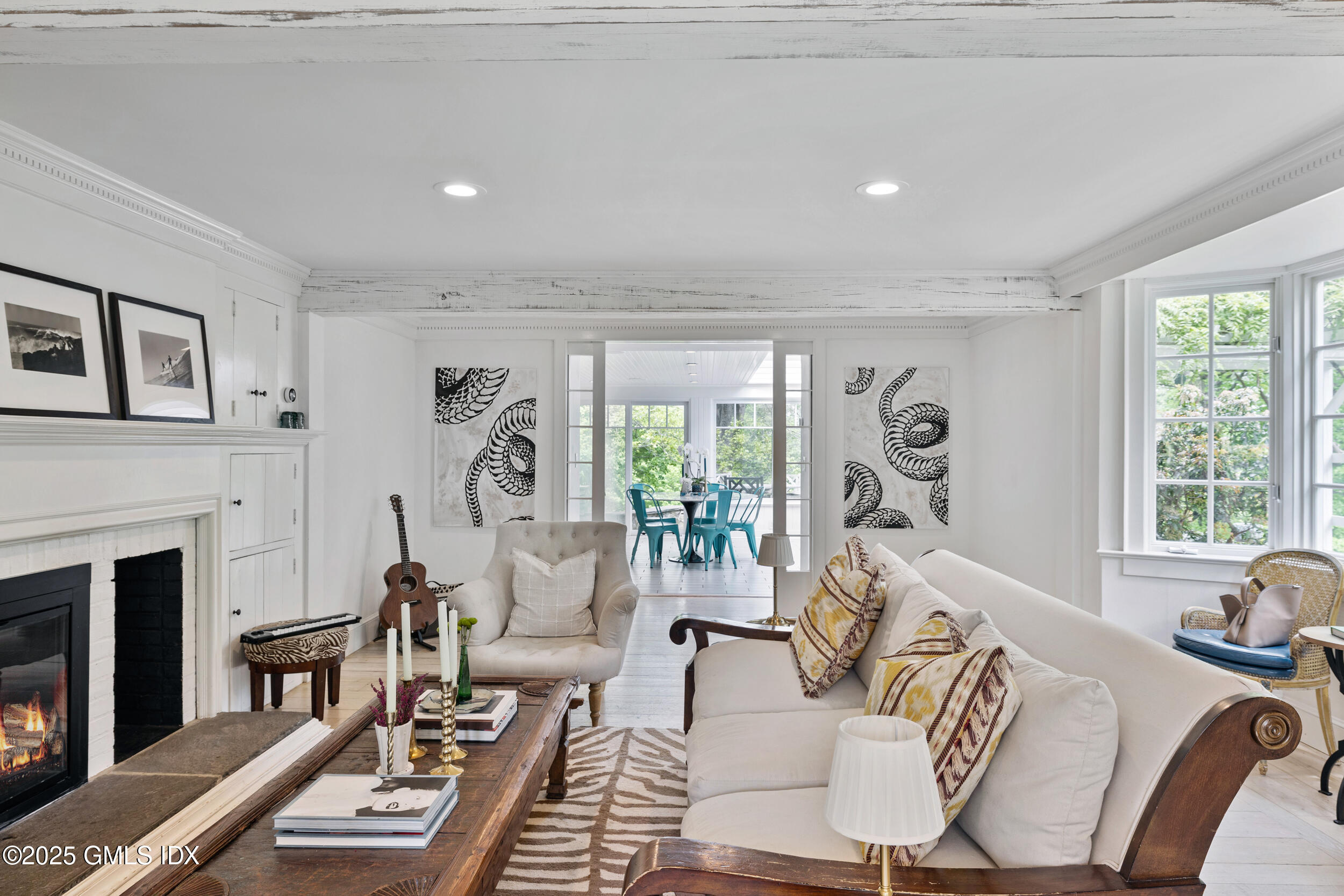 467 Laurel Road New Canaan, CT 06840 - Photo 33 of 50 a living room with furniture windows and a fireplace