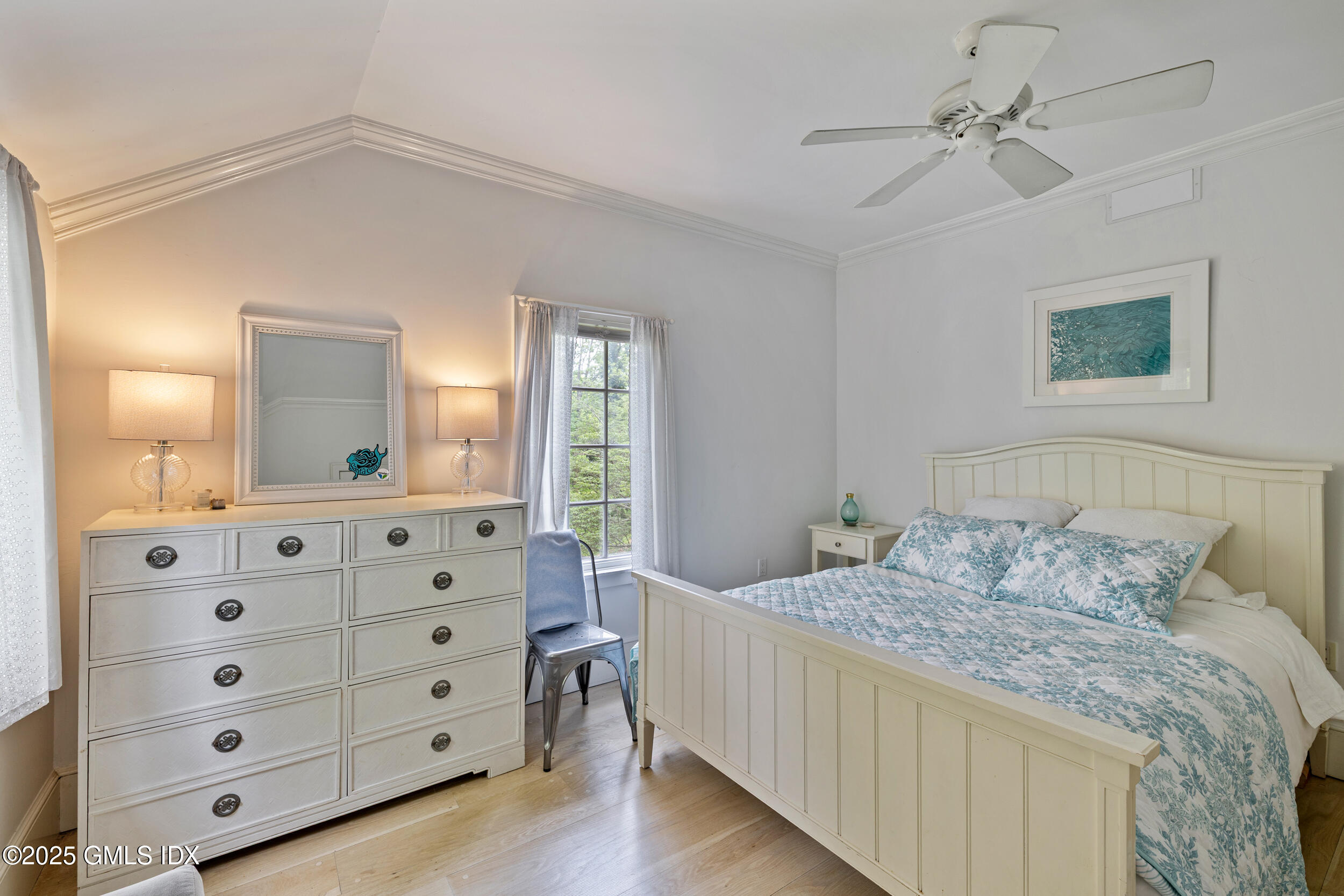 467 Laurel Road New Canaan, CT 06840 - Photo 35 of 50 a bedroom with a bed a dresser and a mirror