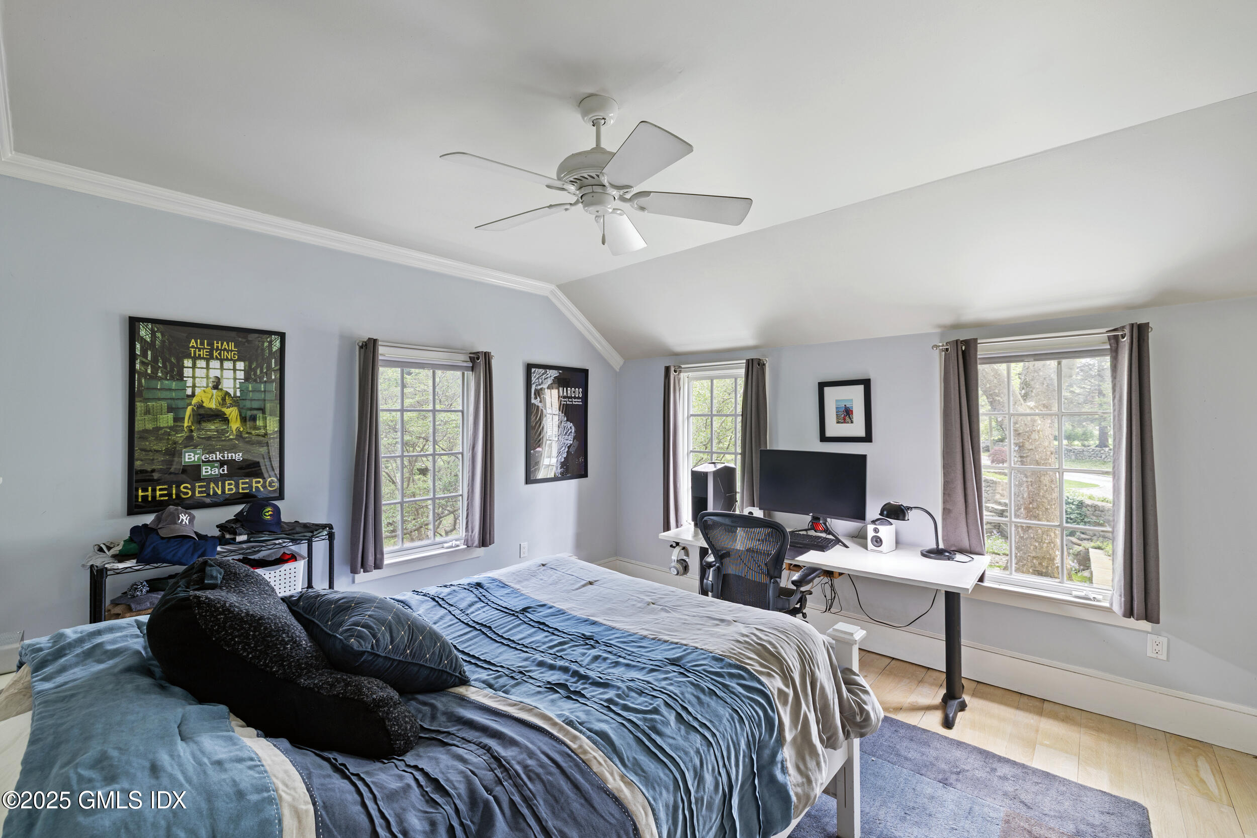 467 Laurel Road New Canaan, CT 06840 - Photo 36 of 50 a bedroom with a bed couch and windows