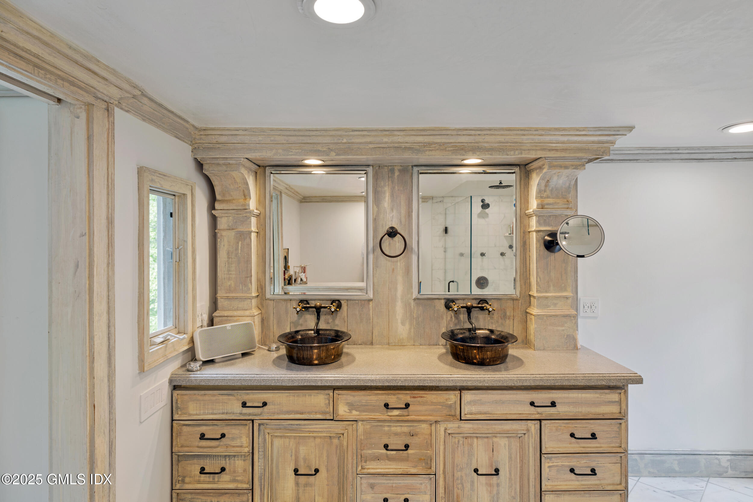 467 Laurel Road New Canaan, CT 06840 - Photo 41 of 50 a bathroom with a granite countertop sink a potted plant and a mirror