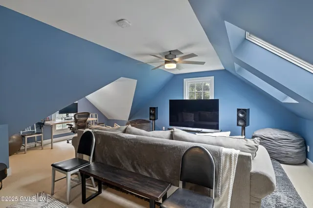 a bedroom with two beds and a flat screen tv