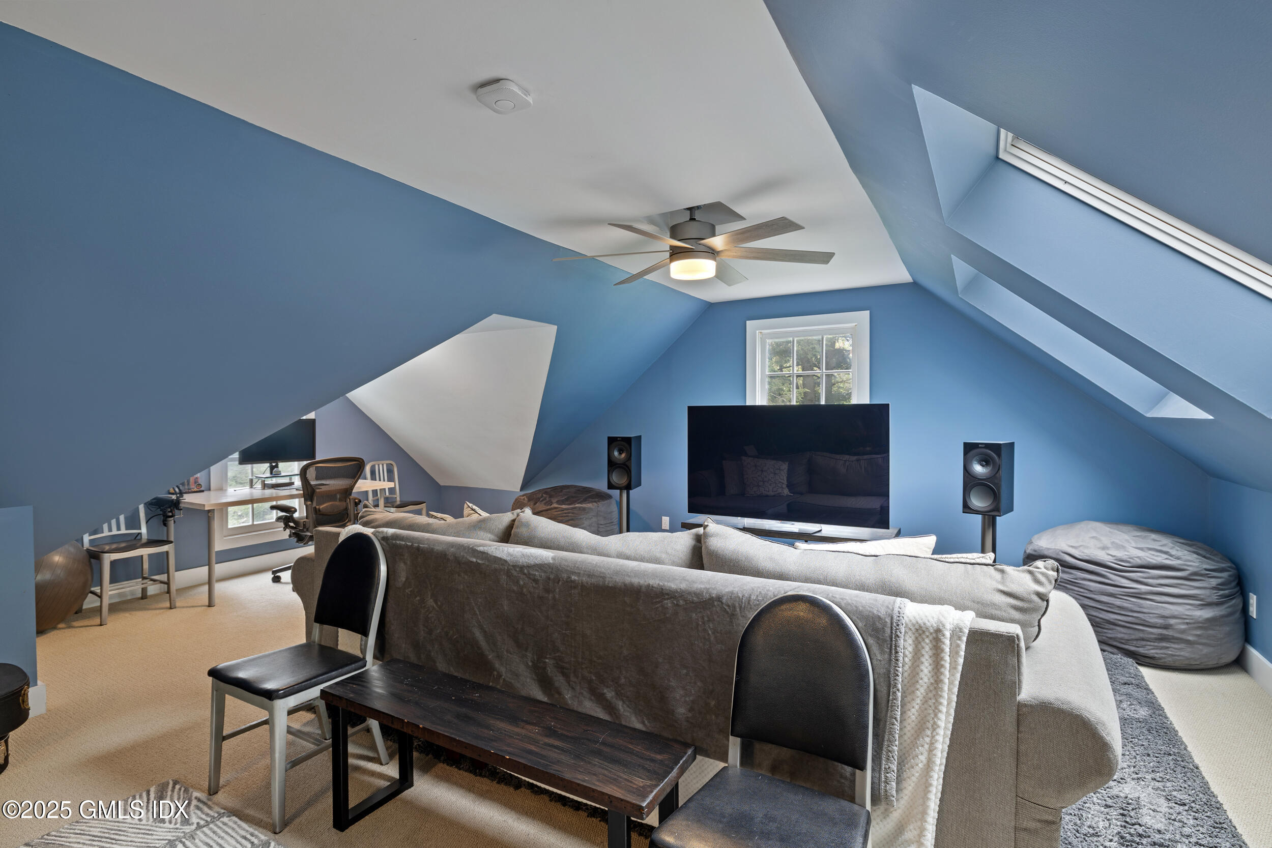 467 Laurel Road New Canaan, CT 06840 - Photo 46 of 50 a bedroom with two beds and a flat screen tv