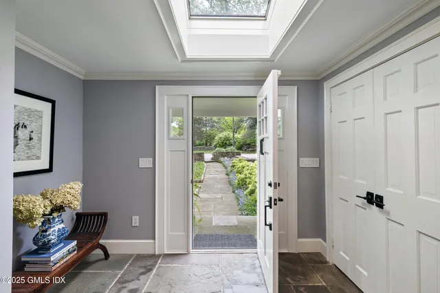 a view of entryway with wooden floor and a potted plant