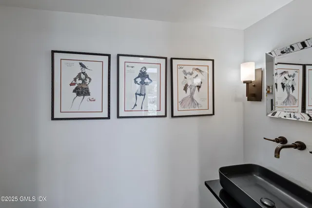 a room with gym equipment and a view of living room