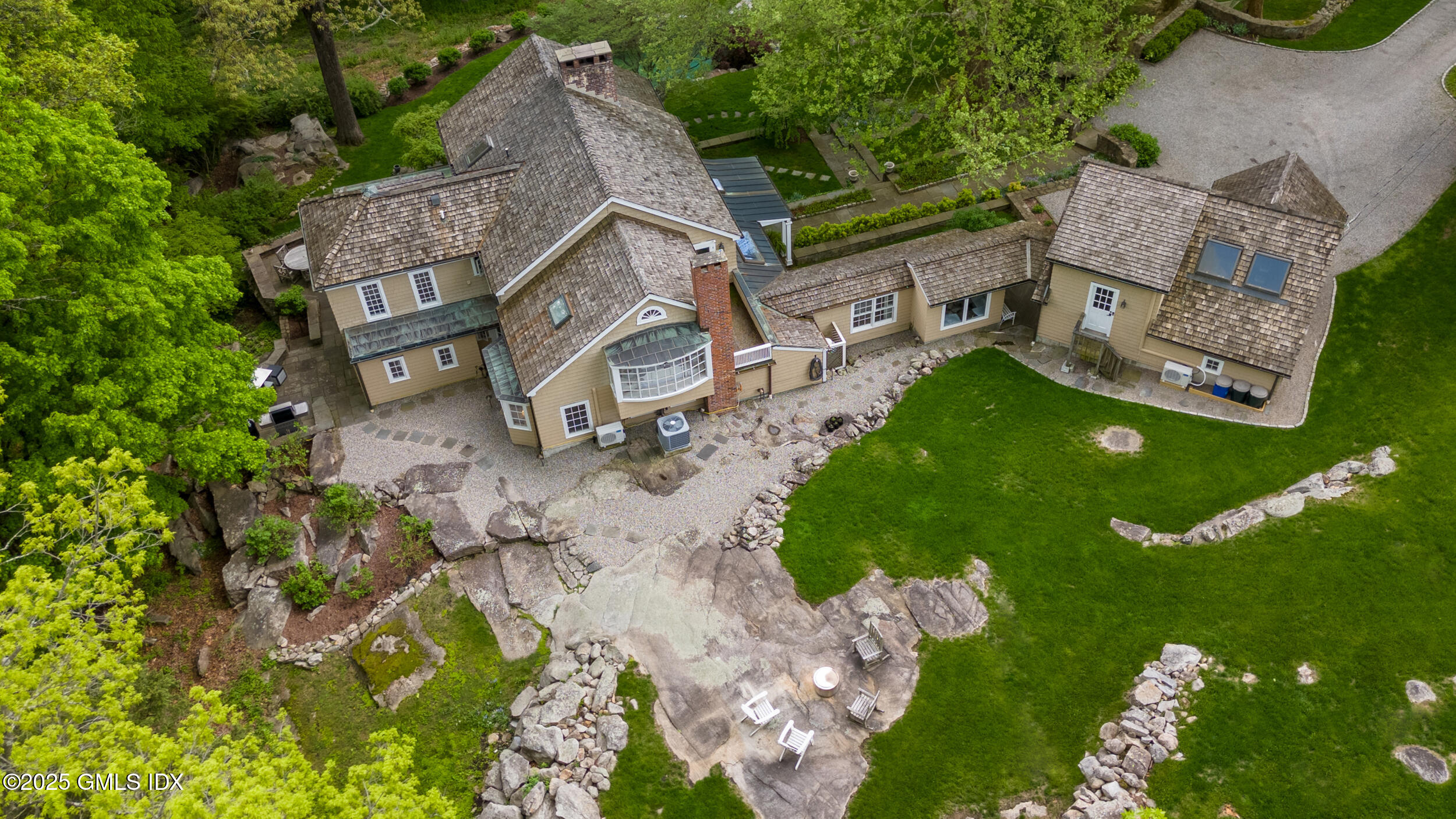 467 Laurel Road New Canaan, CT 06840 - Photo 8 of 50 an aerial view of a house with garden space and street view