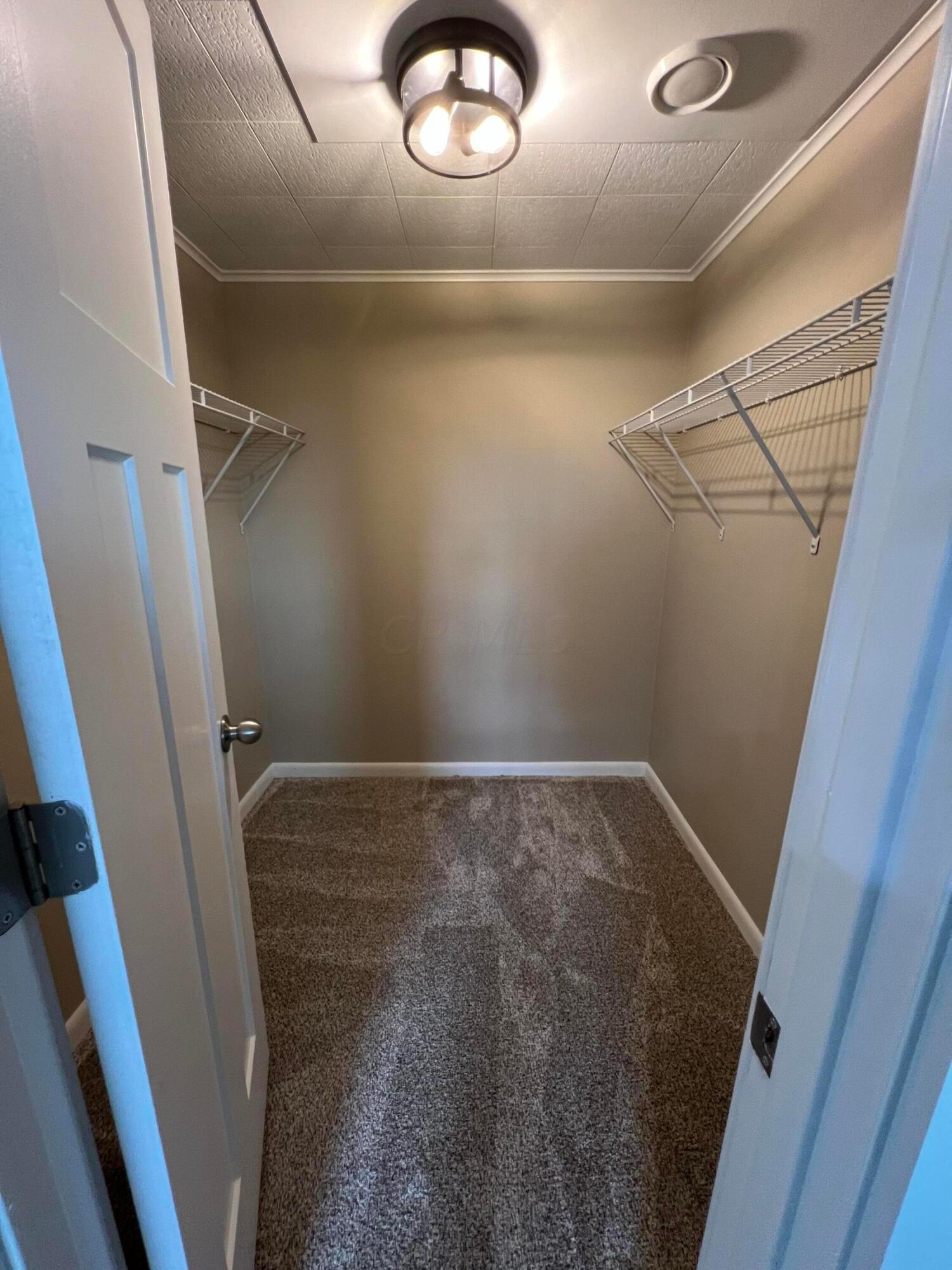 22555 State Rte 207 New Holland, OH 43145 - Photo 29 of 35 Main bedroom walk in closet