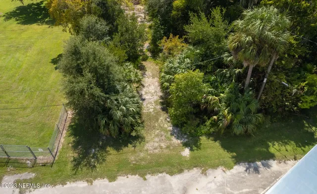 a view of a lake with a yard