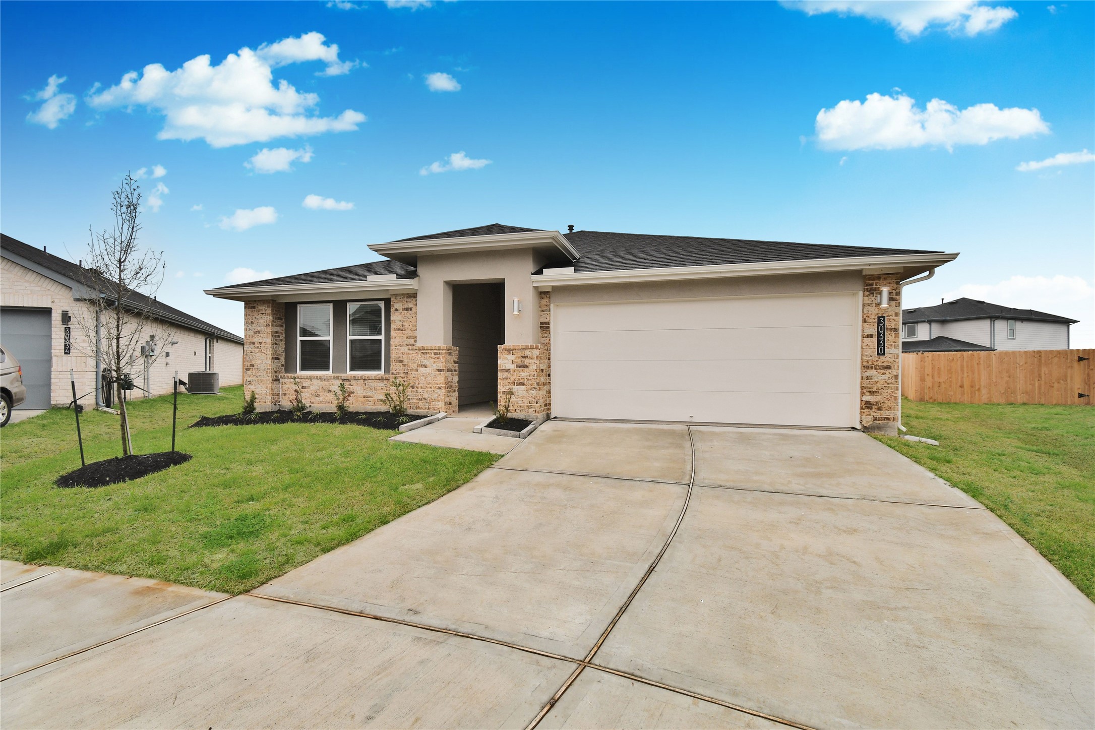 30330 Reagans Rnch Drive Katy, TX 77494 - Photo 2 of 37 Wide driveway and attached garage