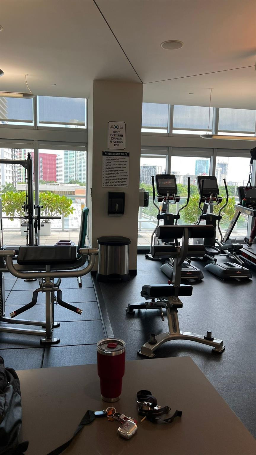 79 Southwest 12th Street, Unit 2908S Miami, FL 33130 - Photo 24 of 29 a room with gym equipment and a window
