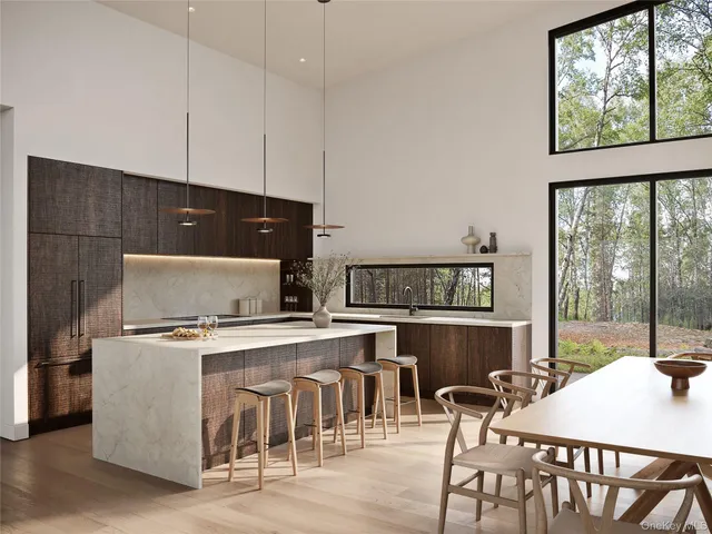 a kitchen with a stove a table and chairs