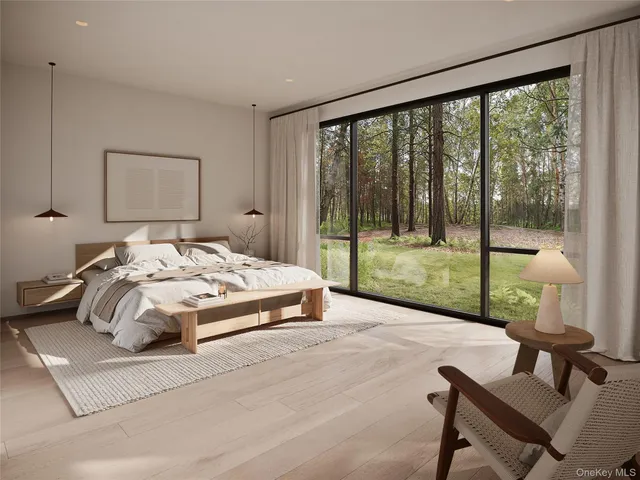 a bedroom with a bed and a view of outdoor space