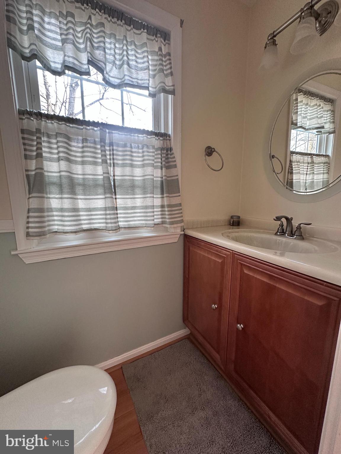 5832 1st Landing Way, Unit 137 Burke, VA 22015 - Photo 13 of 30 a bathroom with a toilet sink and mirror