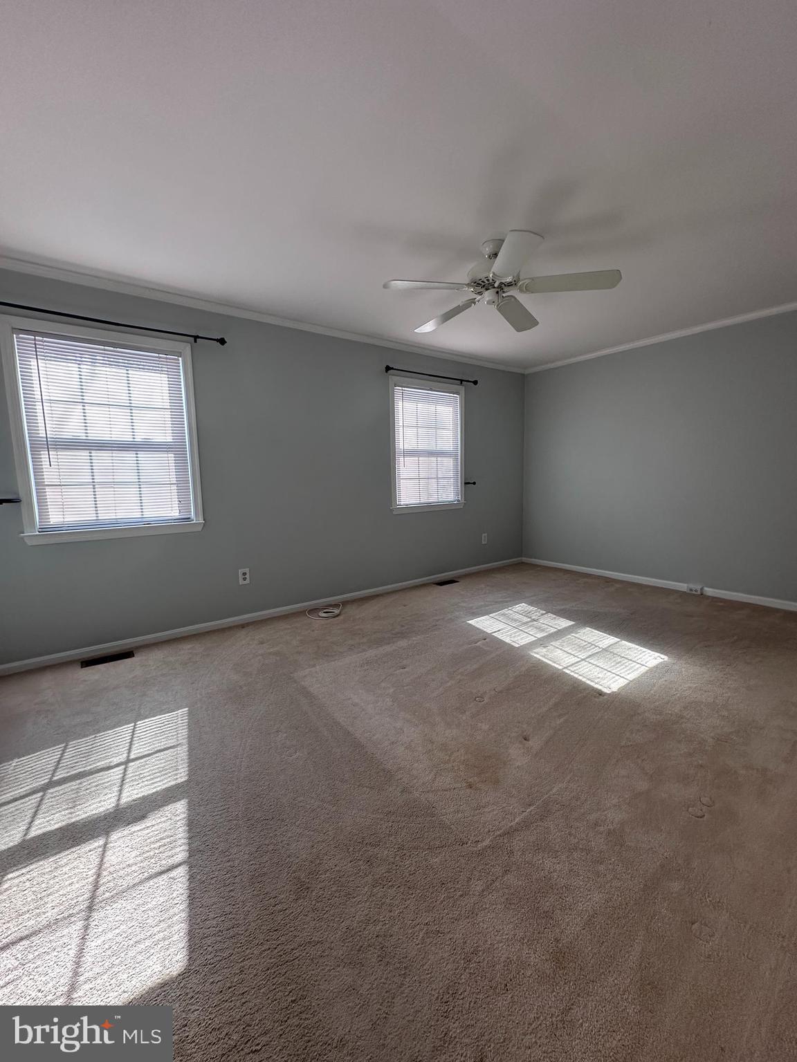 5832 1st Landing Way, Unit 137 Burke, VA 22015 - Photo 17 of 30 an empty room with windows and ceiling fan