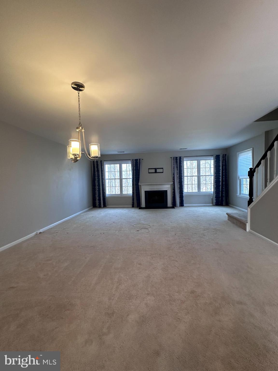 5832 1st Landing Way, Unit 137 Burke, VA 22015 - Photo 10 of 30 a view of empty room with a fireplace