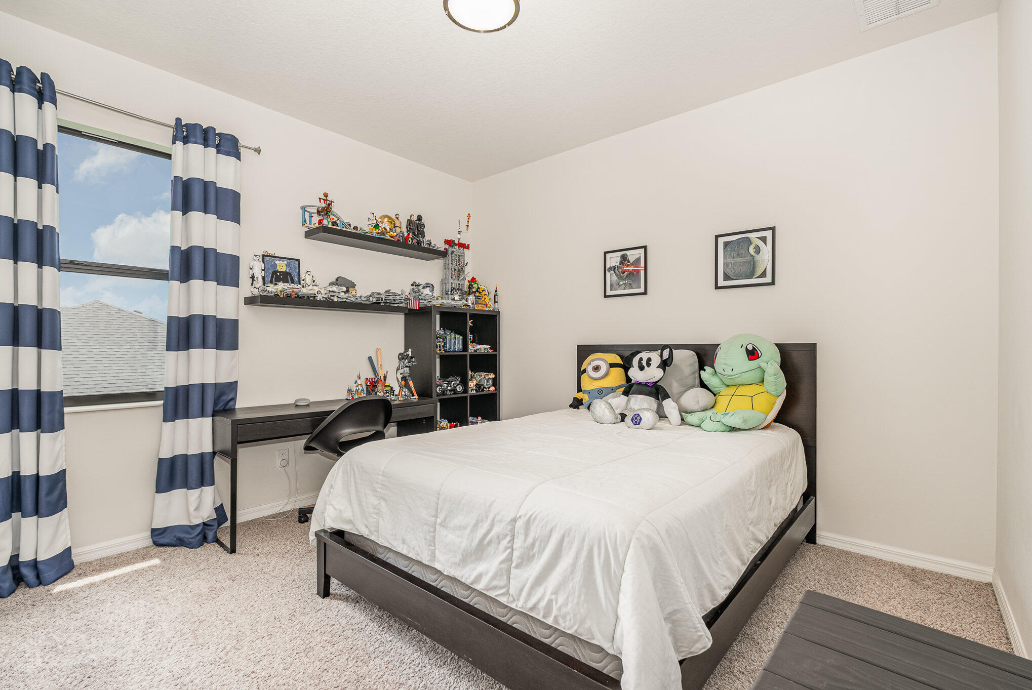 3179 Ribbon Grass Drive Melbourne, FL 32940 - Photo 29 of 52 a bedroom with a bed and a cabinets