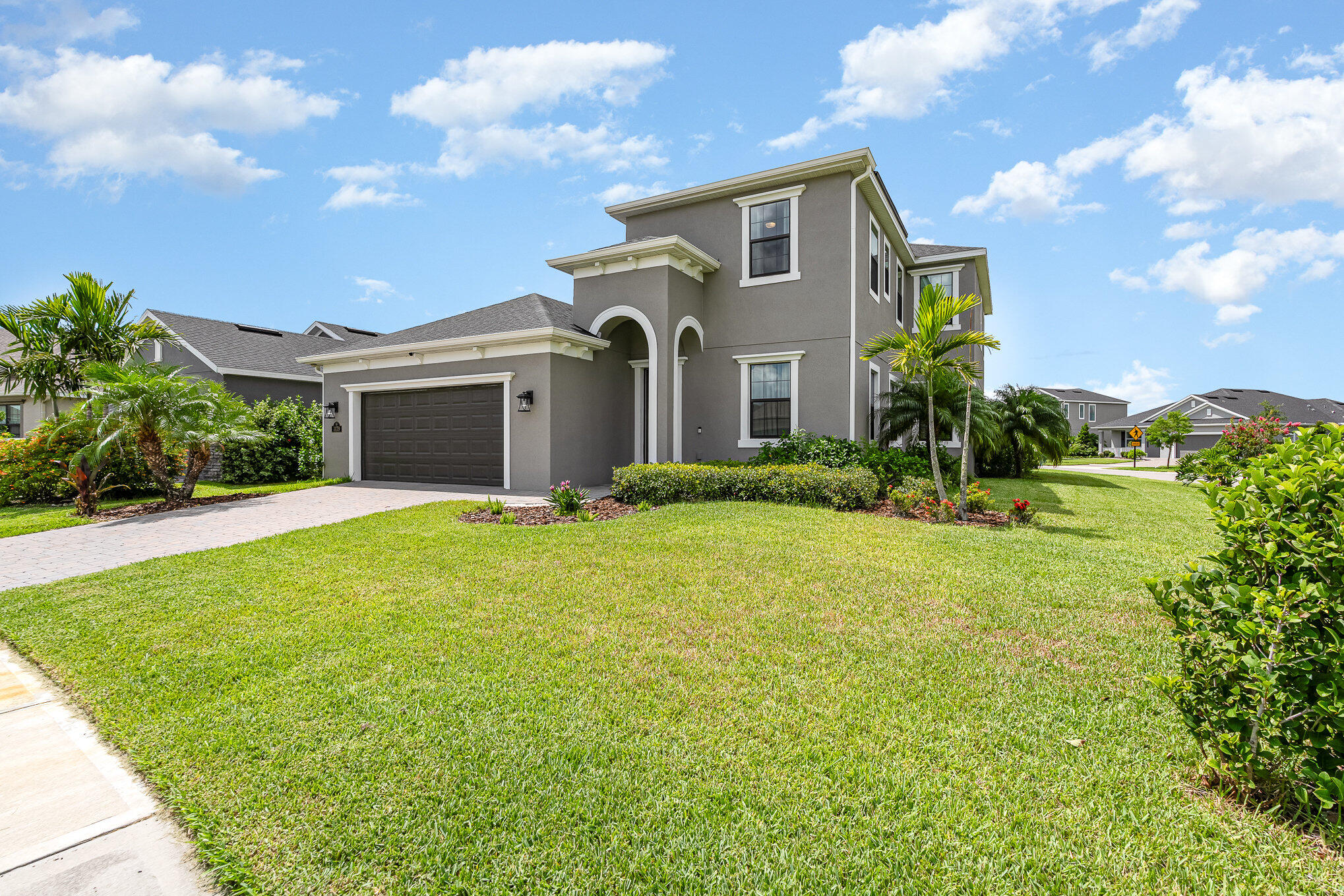 3179 Ribbon Grass Drive Melbourne, FL 32940 - Photo 3 of 52 a front view of a house with garden
