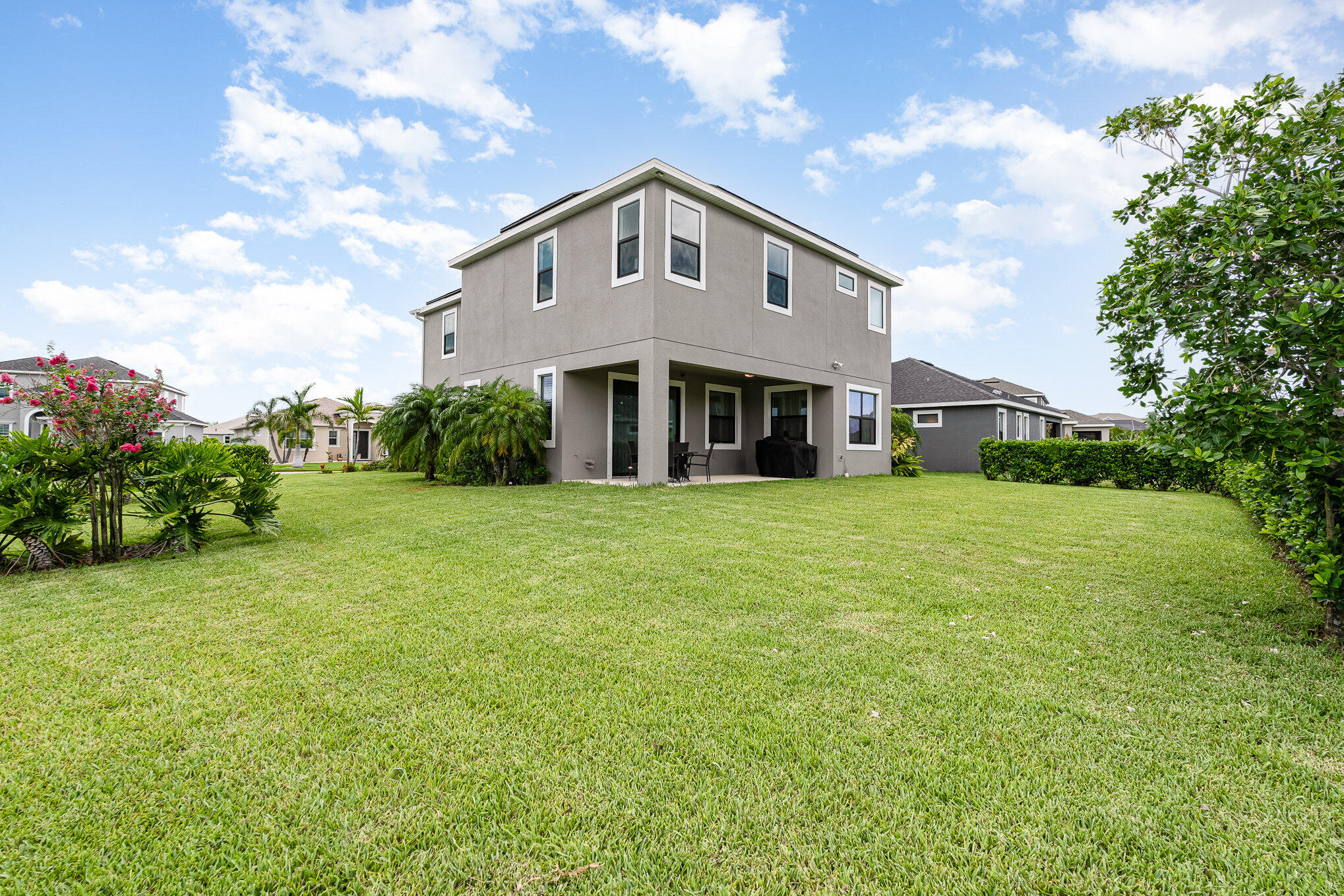 3179 Ribbon Grass Drive Melbourne, FL 32940 - Photo 35 of 52 a front view of a house with a yard