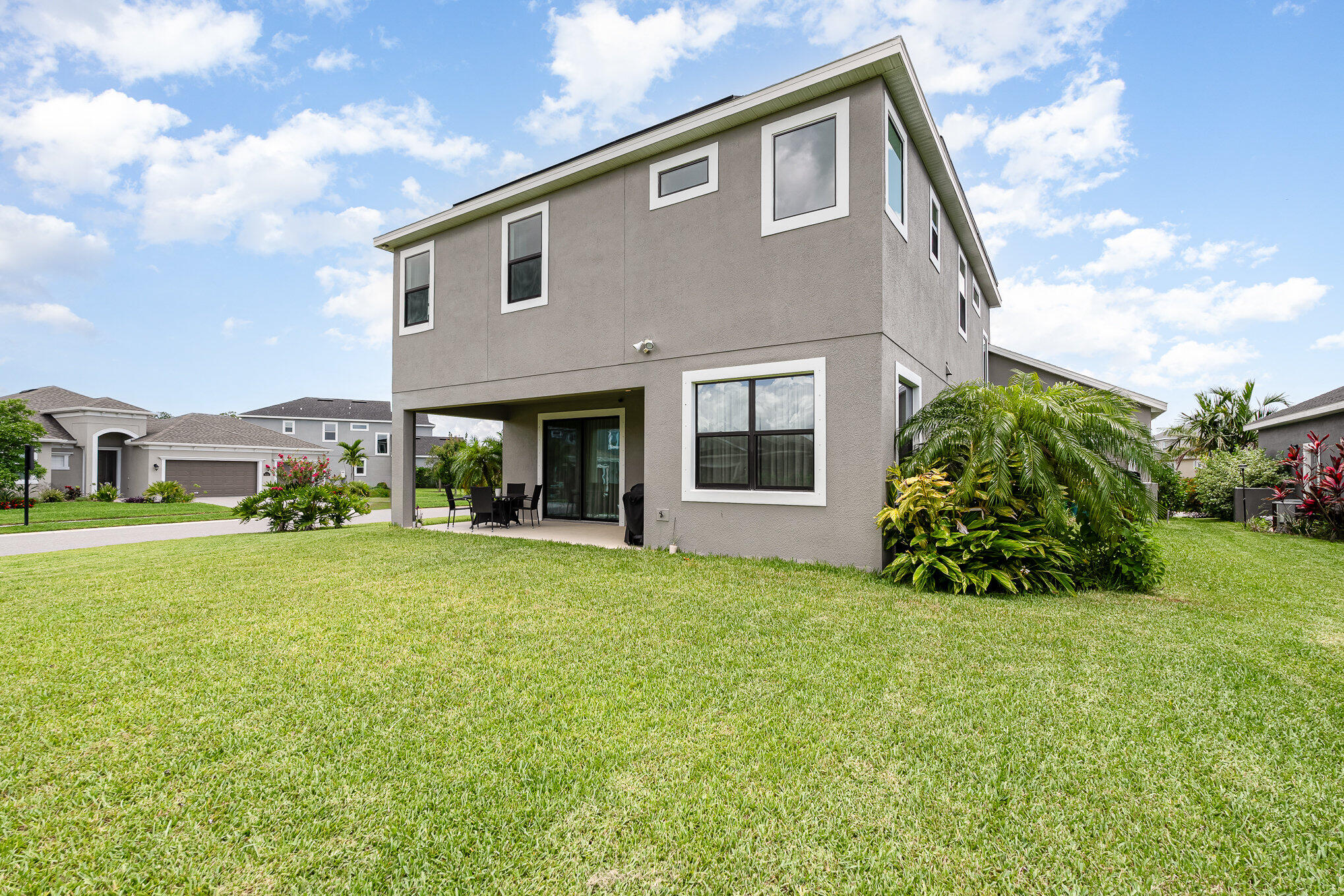 3179 Ribbon Grass Drive Melbourne, FL 32940 - Photo 36 of 52 a front view of a house with a garden