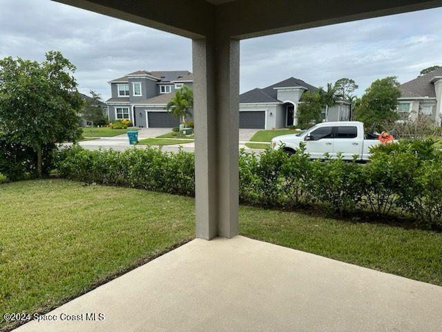 3179 Ribbon Grass Drive Melbourne, FL 32940 - Photo 39 of 52 a front view of a house with a yard