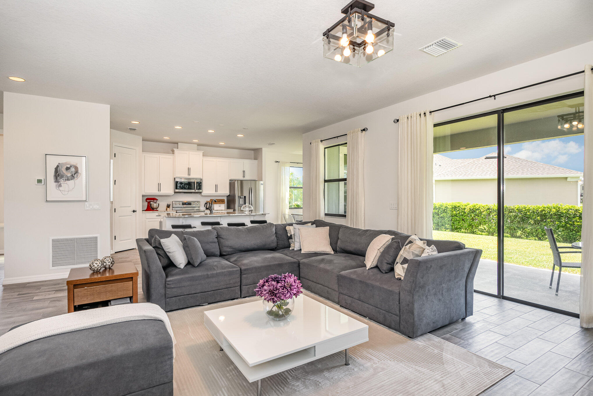 3179 Ribbon Grass Drive Melbourne, FL 32940 - Photo 7 of 52 a living room with furniture and a large window