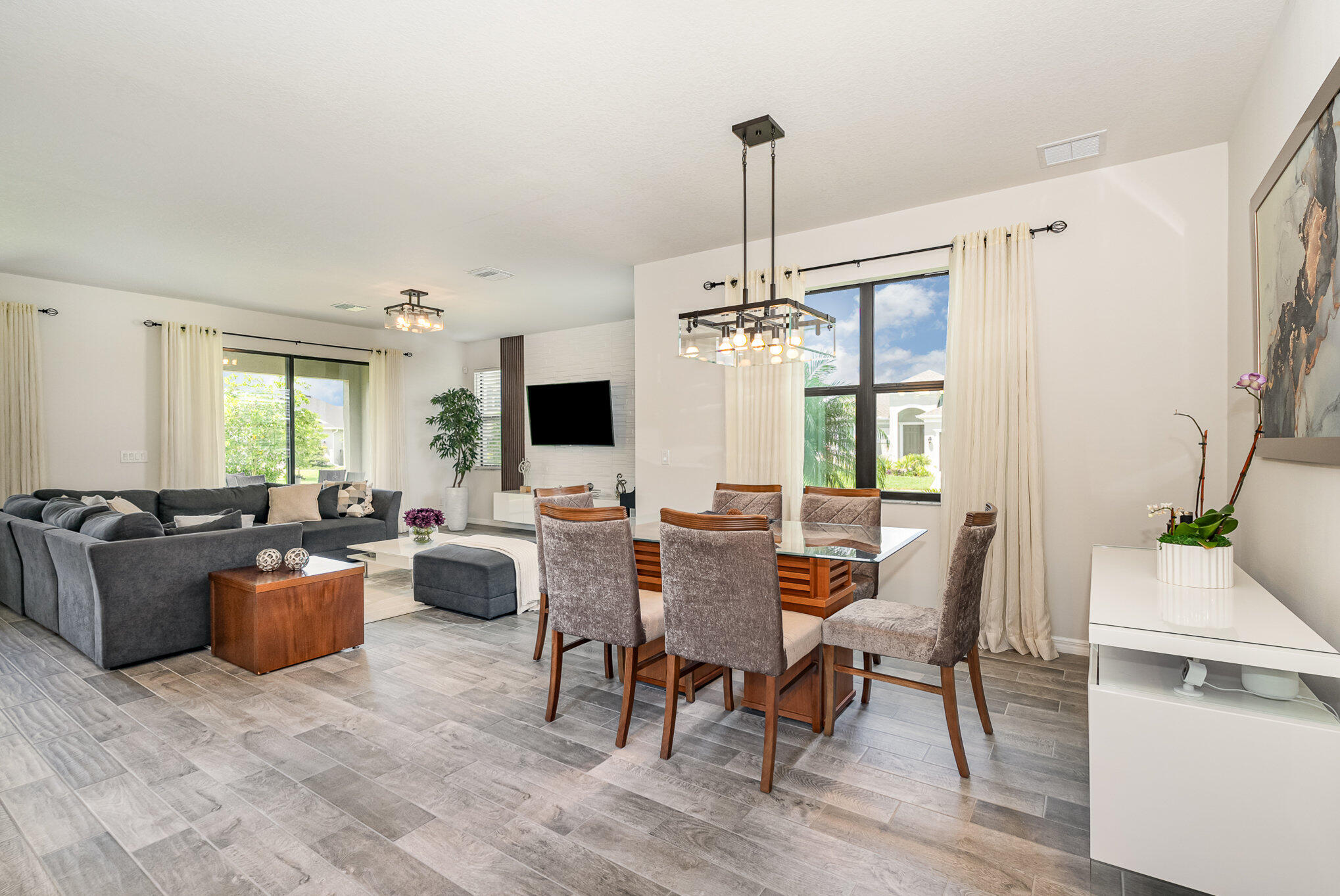 3179 Ribbon Grass Drive Melbourne, FL 32940 - Photo 8 of 52 a view of a dining room with furniture window and wooden floor