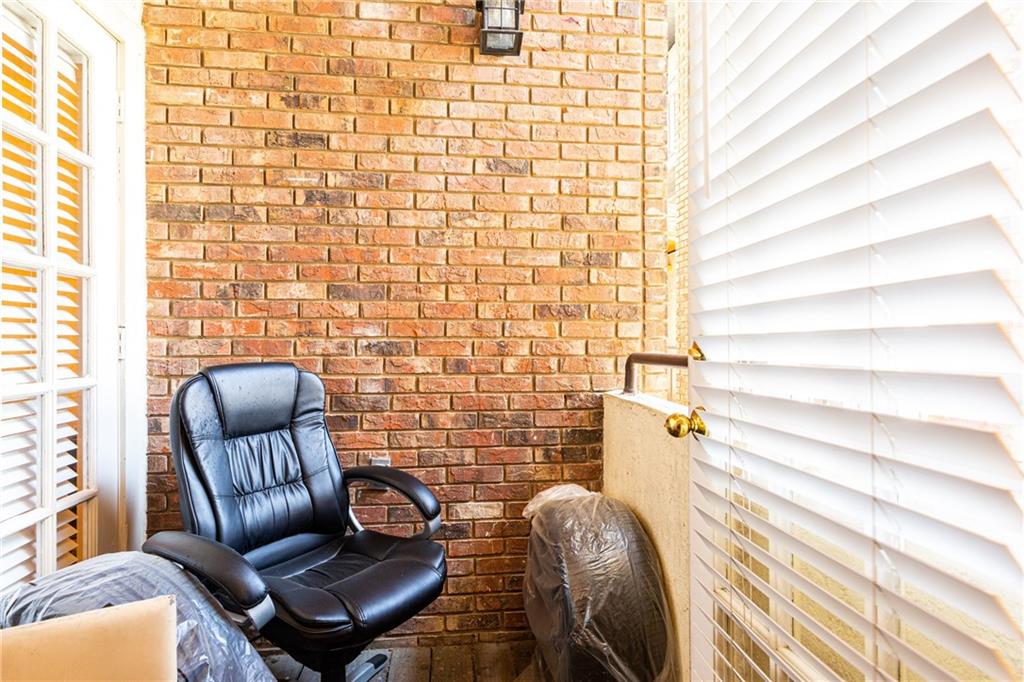 3001 Cedar Street, Unit 209 Austin, TX 78705 - Photo 12 of 17 a view of a chair and couch in wooden floor