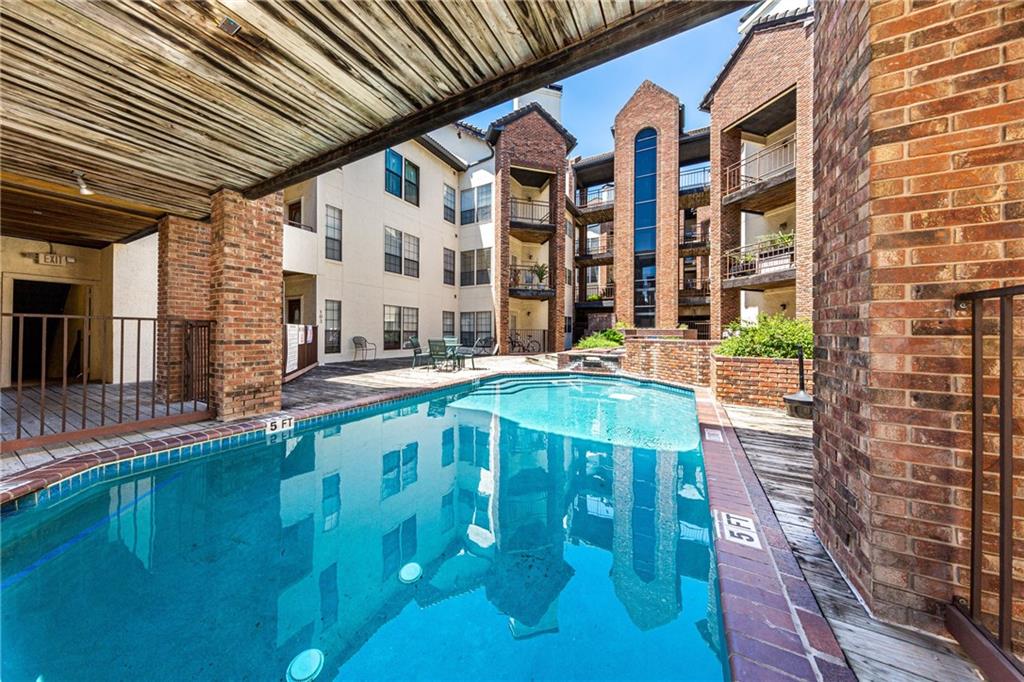 3001 Cedar Street, Unit 209 Austin, TX 78705 - Photo 2 of 17 a view of building with swimming pool