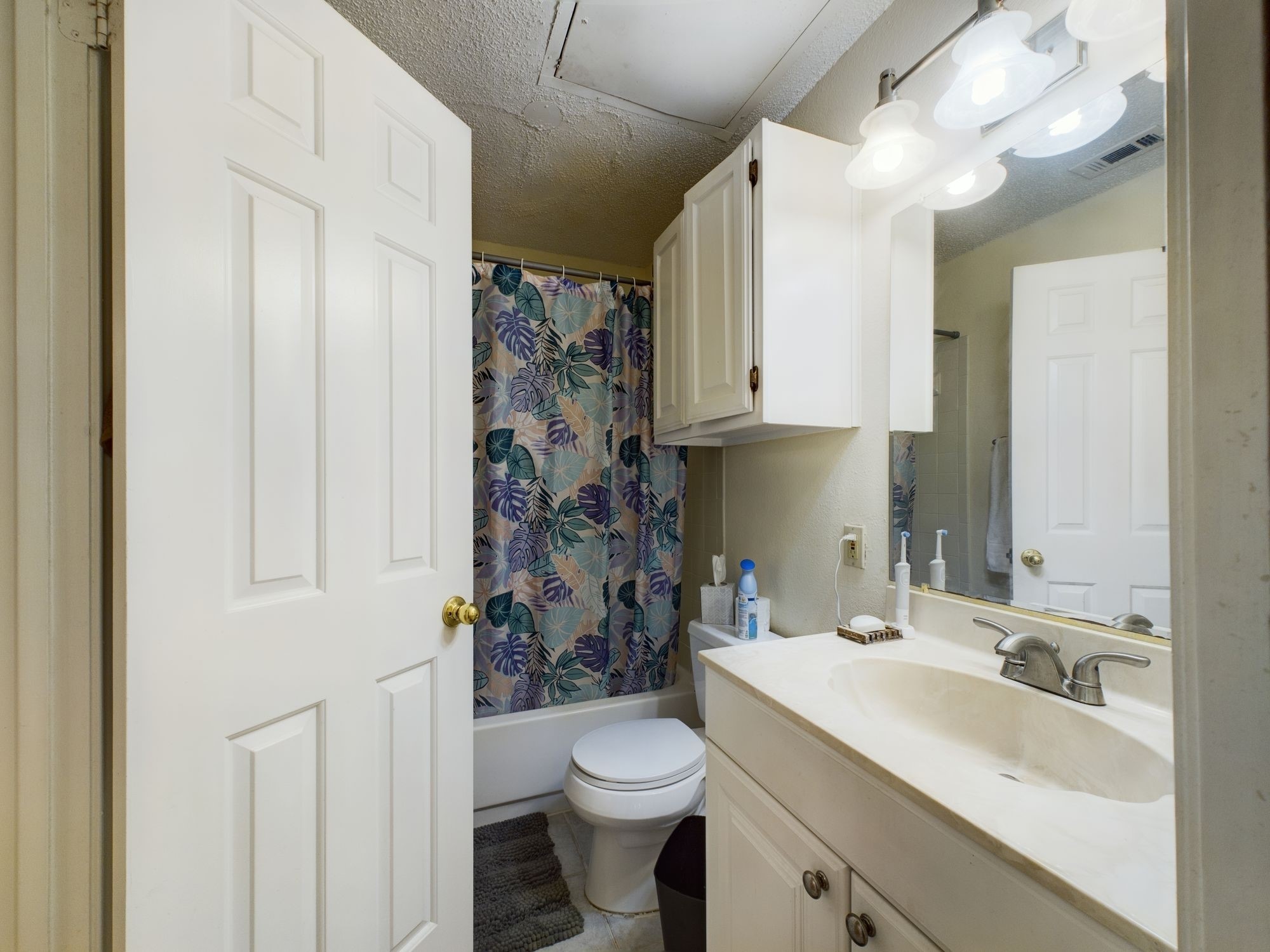 3001 Cedar Street, Unit 209 Austin, TX 78705 - Photo 9 of 17 a bathroom with a sink toilet and shower