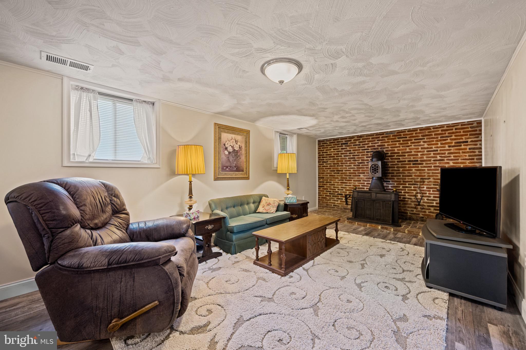245 Candytuft Road Reisterstown, MD 21136 - Photo 26 of 40 Family room brick hearth wood stove