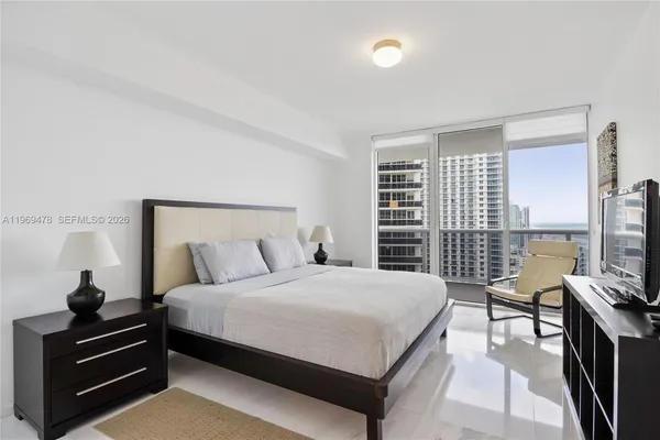 a bedroom with a bed and furniture