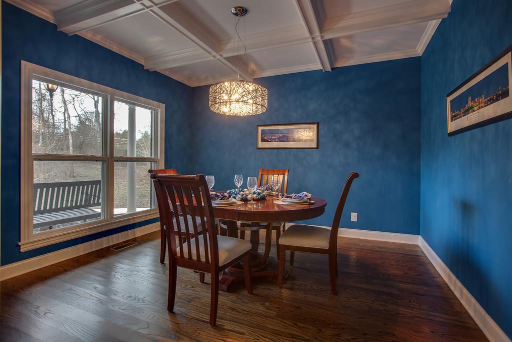 4065 Clovercroft Road Franklin, TN 37067 - Photo 11 of 30 a view of a dining room with furniture window and wooden floor