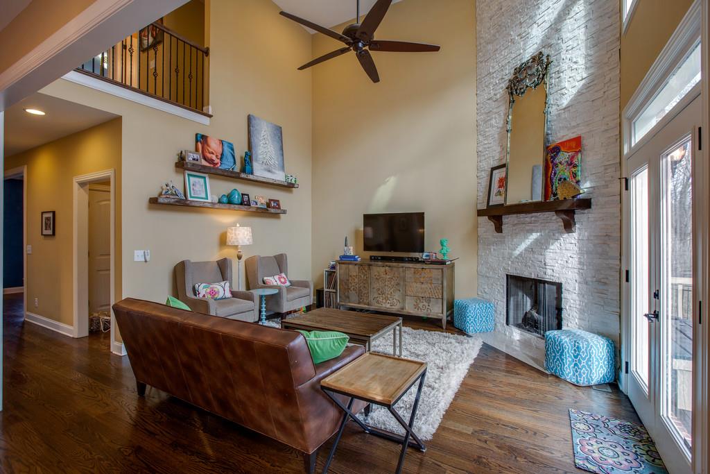 4065 Clovercroft Road Franklin, TN 37067 - Photo 12 of 30 a living room with furniture a fireplace and a flat screen tv
