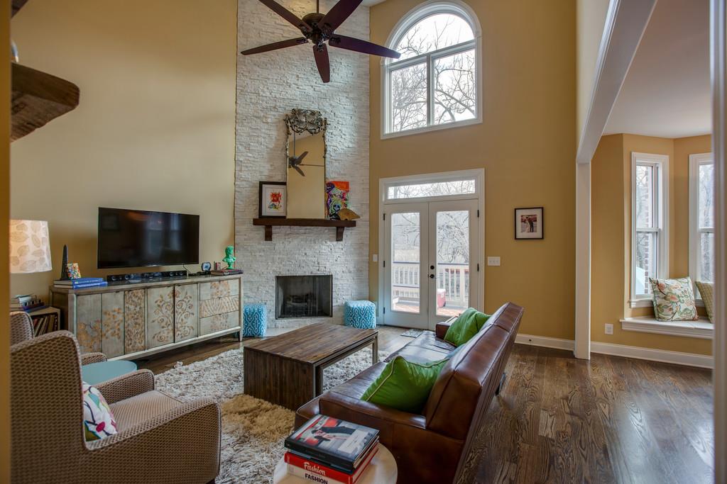 4065 Clovercroft Road Franklin, TN 37067 - Photo 13 of 30 a living room with furniture a fireplace and a flat screen tv