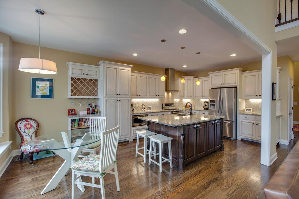 4065 Clovercroft Road Franklin, TN 37067 - Photo 16 of 30 a kitchen with stainless steel appliances granite countertop a stove refrigerator and a refrigerator