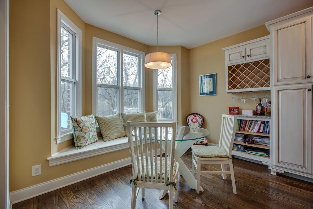 4065 Clovercroft Road Franklin, TN 37067 - Photo 17 of 30 a dining room with furniture a chandelier and wooden floor