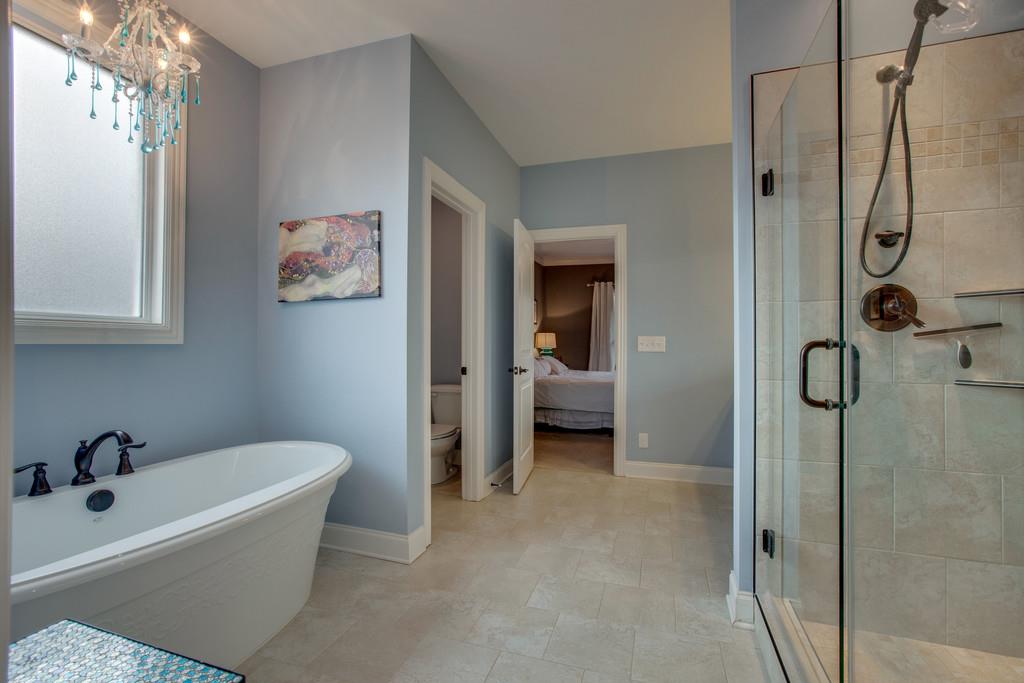 4065 Clovercroft Road Franklin, TN 37067 - Photo 20 of 30 a bathroom with a tub and shower