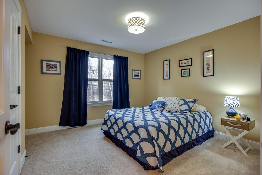 4065 Clovercroft Road Franklin, TN 37067 - Photo 23 of 30 a bedroom with a bed and window