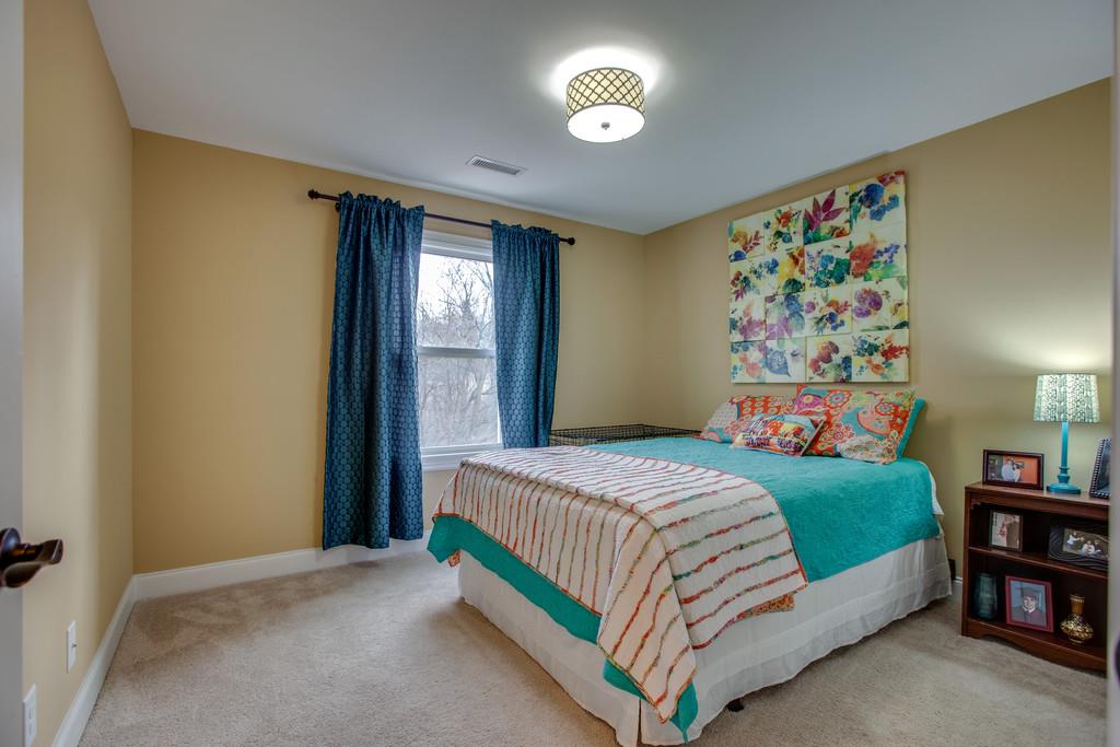 4065 Clovercroft Road Franklin, TN 37067 - Photo 24 of 30 a bedroom with a bed and a book shelf
