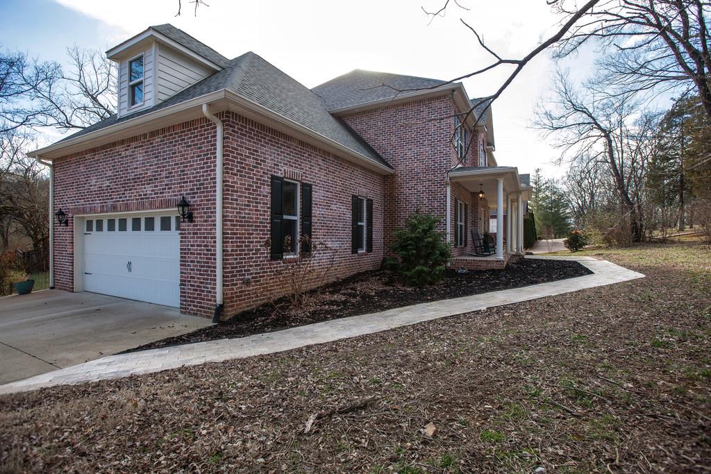 4065 Clovercroft Road Franklin, TN 37067 - Photo 8 of 30 a front view of a house with a yard
