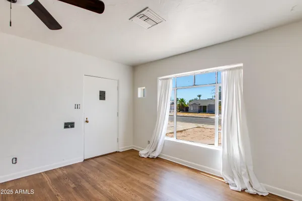 a view of an empty room with a window