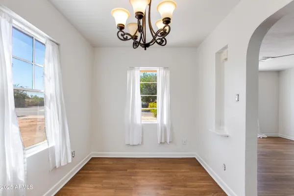 a view of an entryway with wooden floor