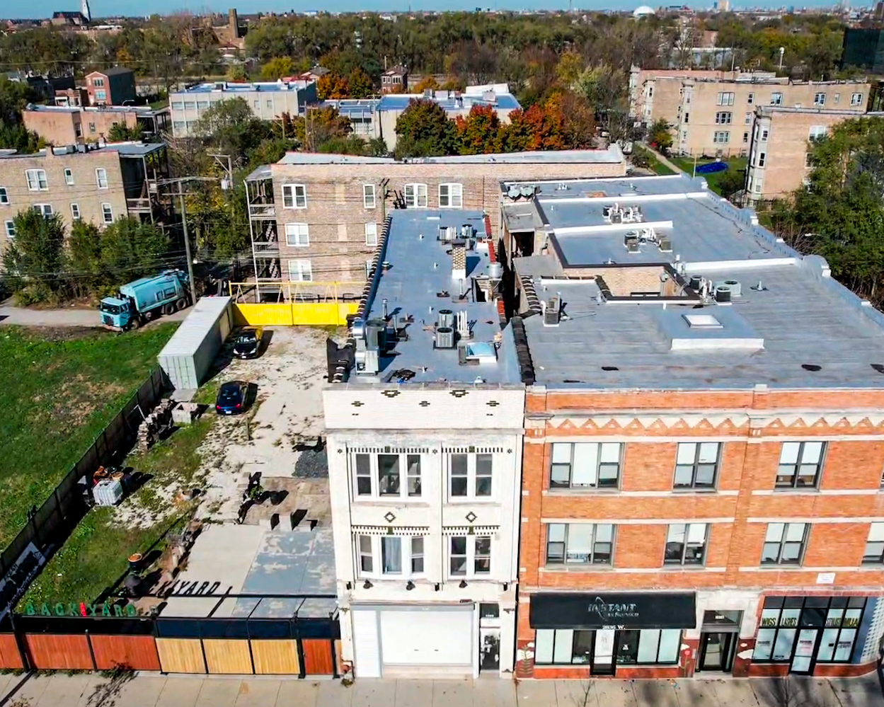 2838 West Roosevelt Road, Unit 3R Chicago, IL 60612 - Photo 1 of 23 an aerial view of residential building with swimming pool and ocean view