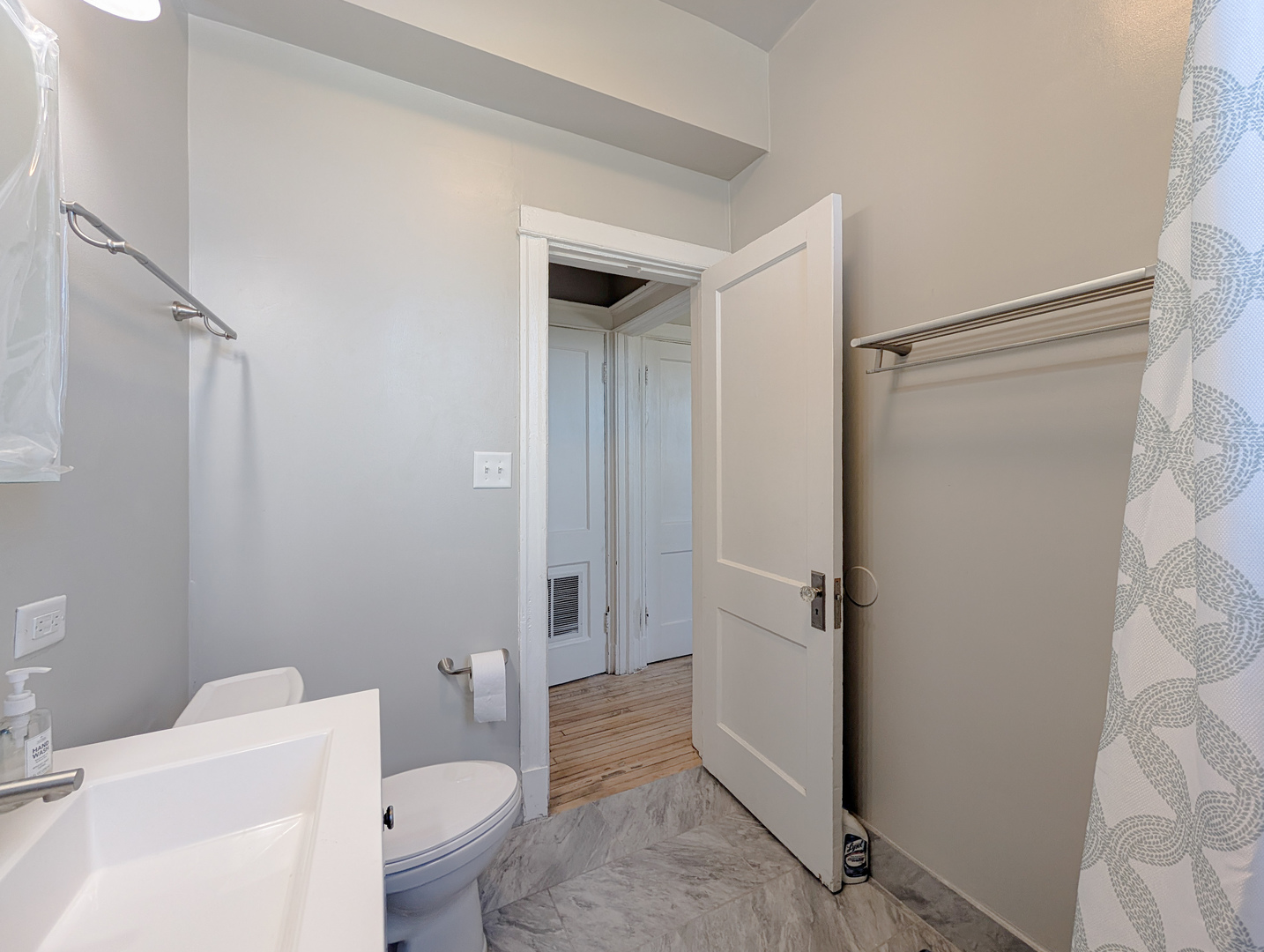 2838 West Roosevelt Road, Unit 3R Chicago, IL 60612 - Photo 16 of 23 a bathroom with a granite countertop sink toilet and shower